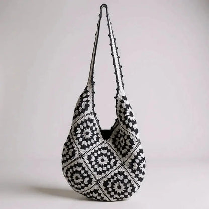 Black and white hand-woven cotton yarn shoulder bag with geometric crochet pattern