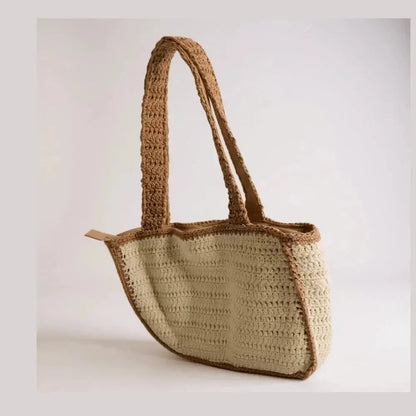 Handmade crochet tote bag with beige and brown cotton yarn, boho style, on plain background