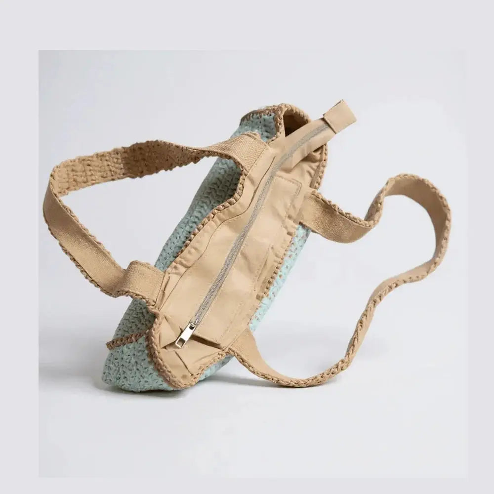 Handmade crochet tote bag with beige cotton yarn, zipper closure, and shoulder straps