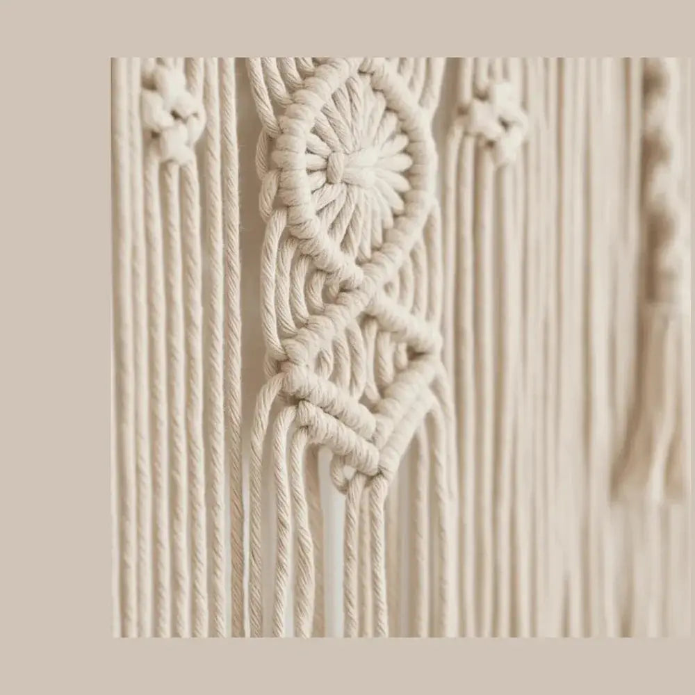 Handmade macrame wall hanging with intricate boho tapestry knot details, neutral beige cotton.