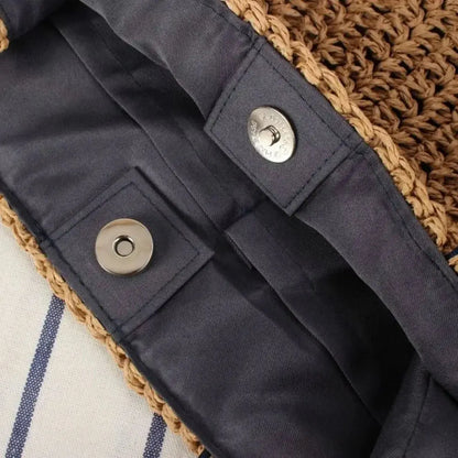 Interior of woven raffia tote bag with magnetic snap closure and fabric lining