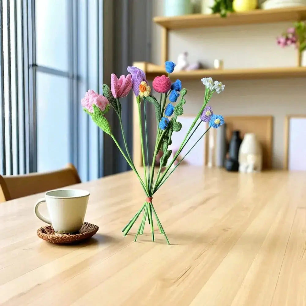 Handmade crochet flower bouquet centerpiece on modern wooden dining table